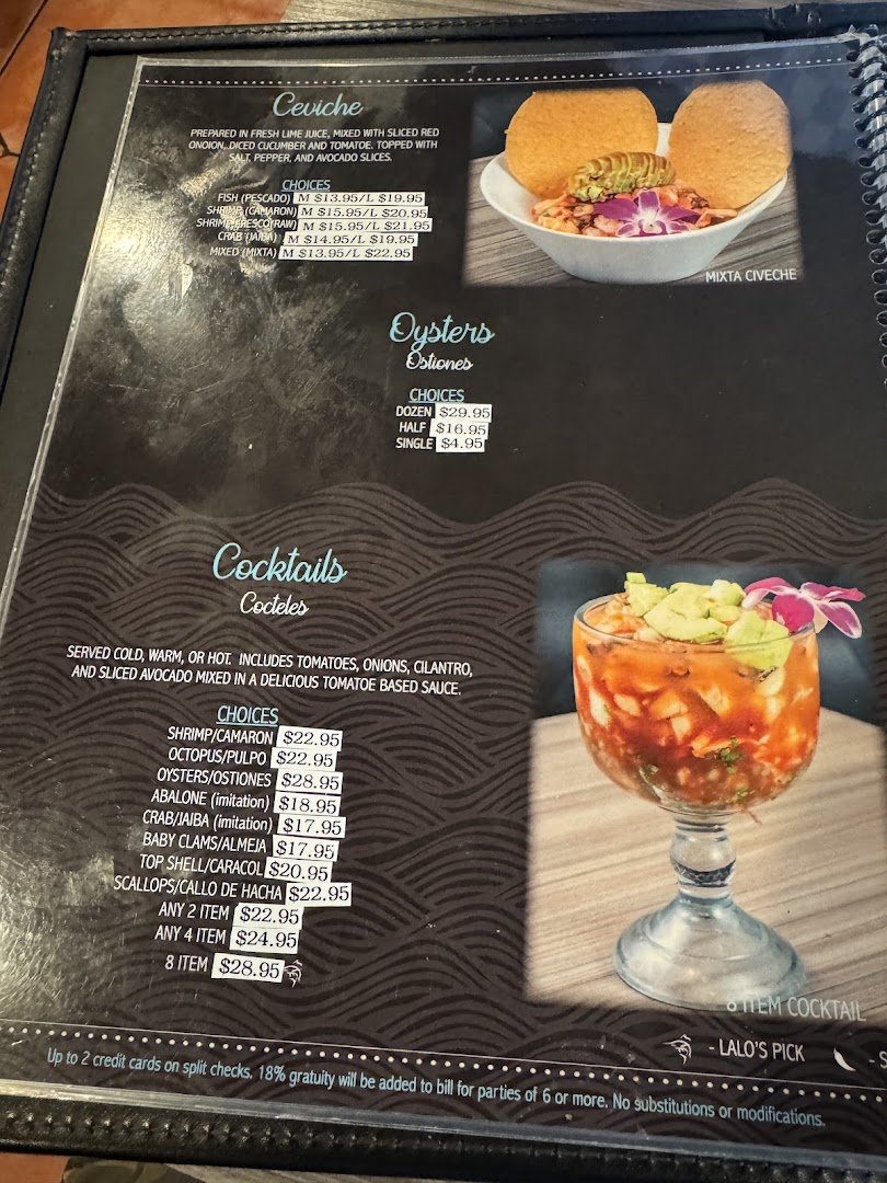 Fresh seafood plates with drinks on a table.