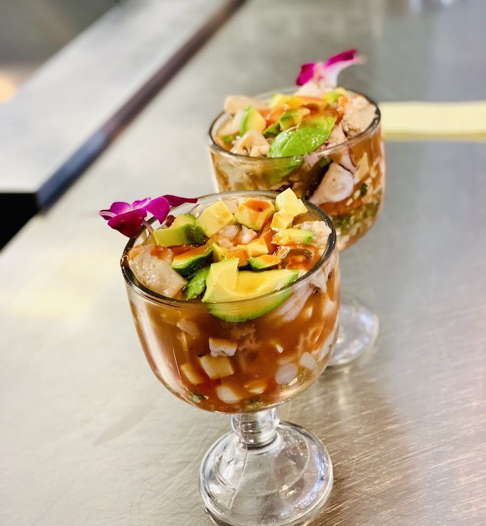 Printed menu with seafood and Mexican options.
