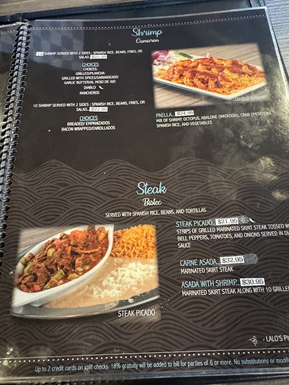 Printed menu with seafood and Mexican options.
